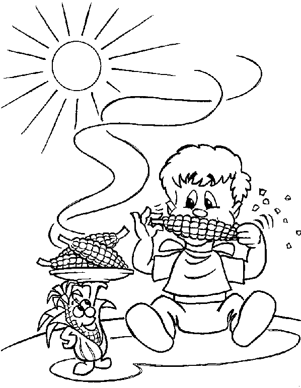 Мальчик ест кукурузу