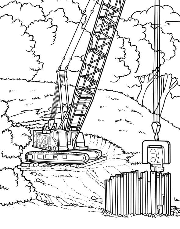 Подъемный кран строит забор